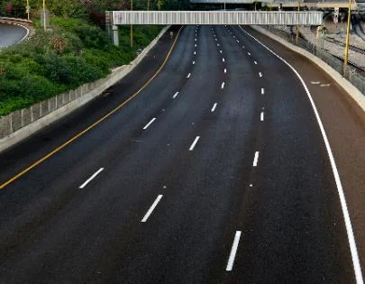 a pavement marking allowing lane changes when safe to do so.