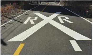 pavement markings used to indicate an upcoming railroad crossing.